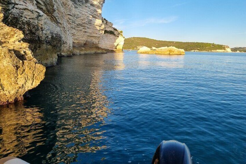 A coastal landscape with cliffs and calm sea. 4