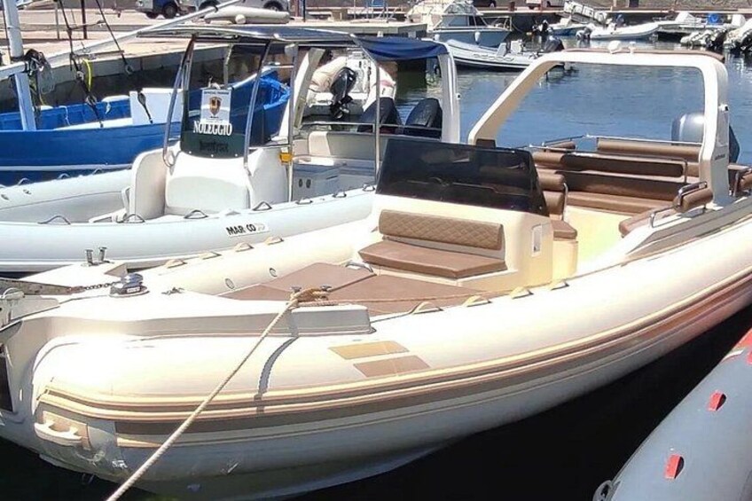 A row of boats docked at a marina. 5