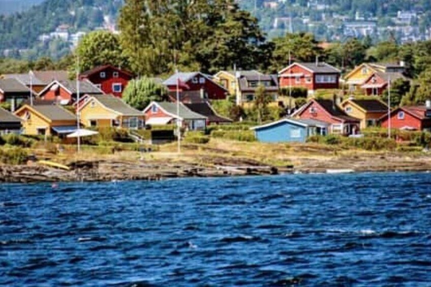 A coastal village with colorful houses by the water. 5