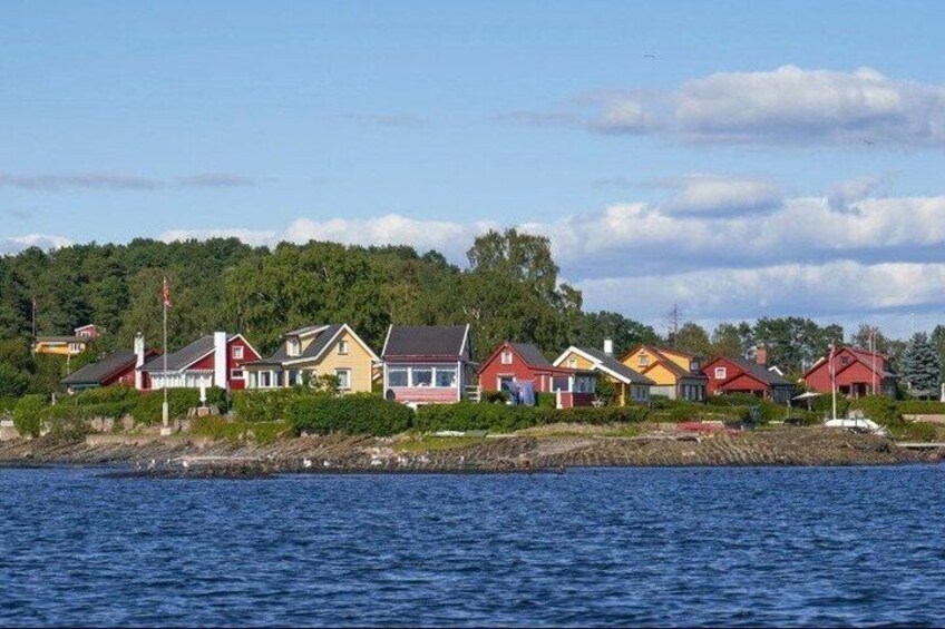 A coastal village with colorful houses by the water. 4