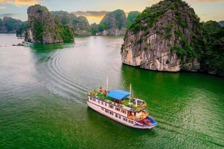 A boat on a river surrounded by limestone karsts. 2