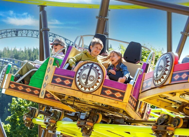 A wooden roller coaster with passengers. 4