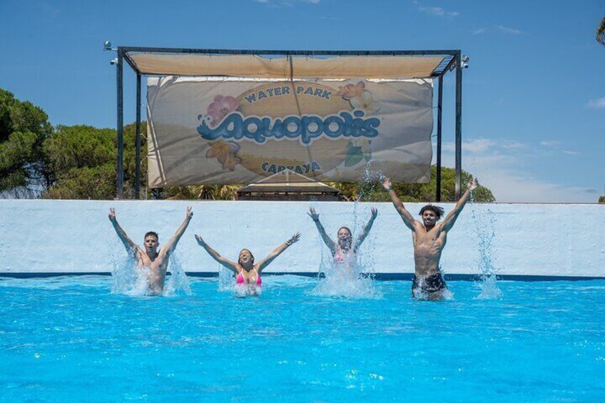 A water park with a large banner reading 'Water Park Aquapolis Cartagena.' 5