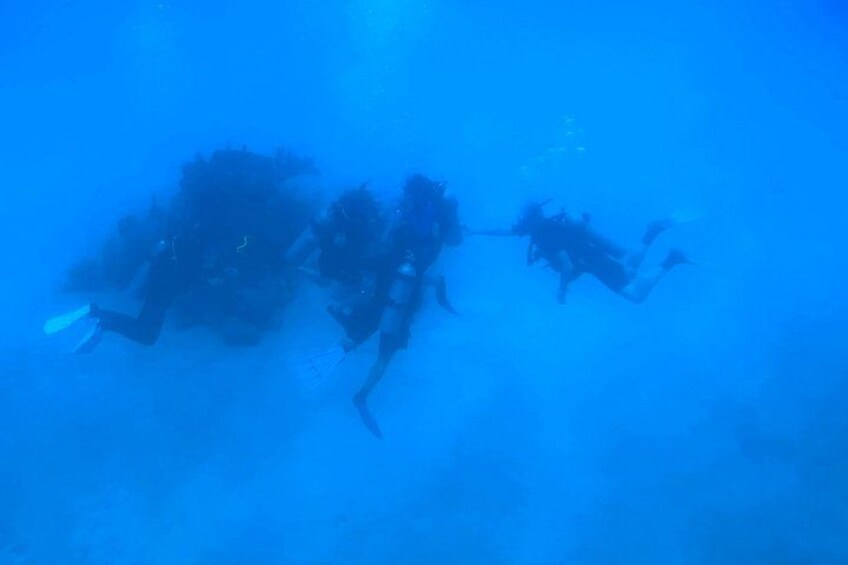 A group of scuba divers underwater. 2
