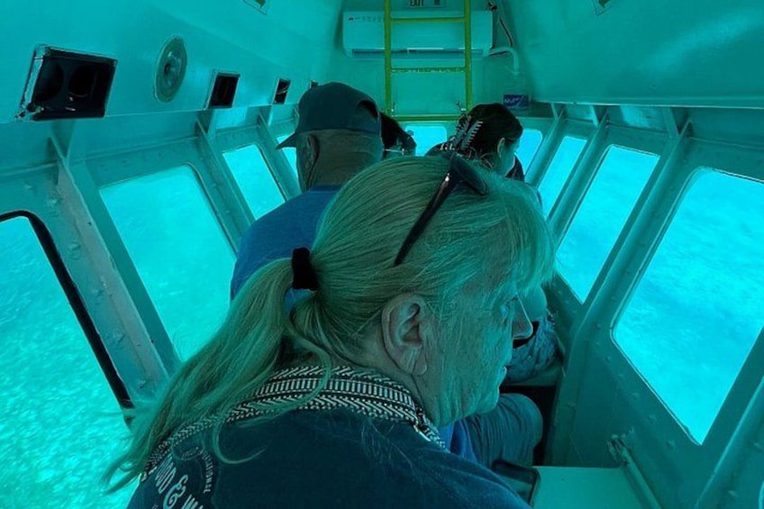 People inside a boat, looking out at the water. 1