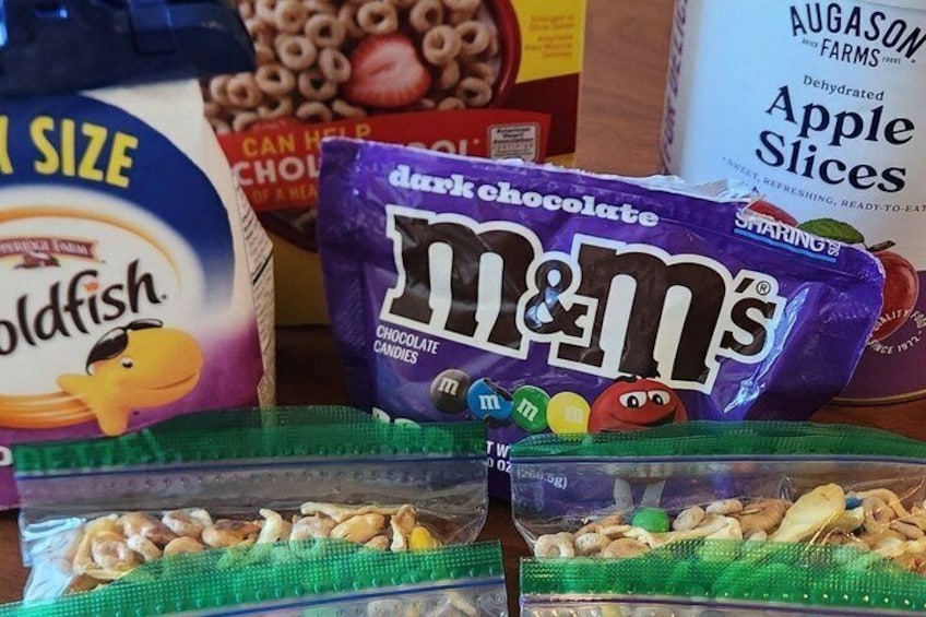 A variety of food items including cereal, chocolate candies, and nuts. 3