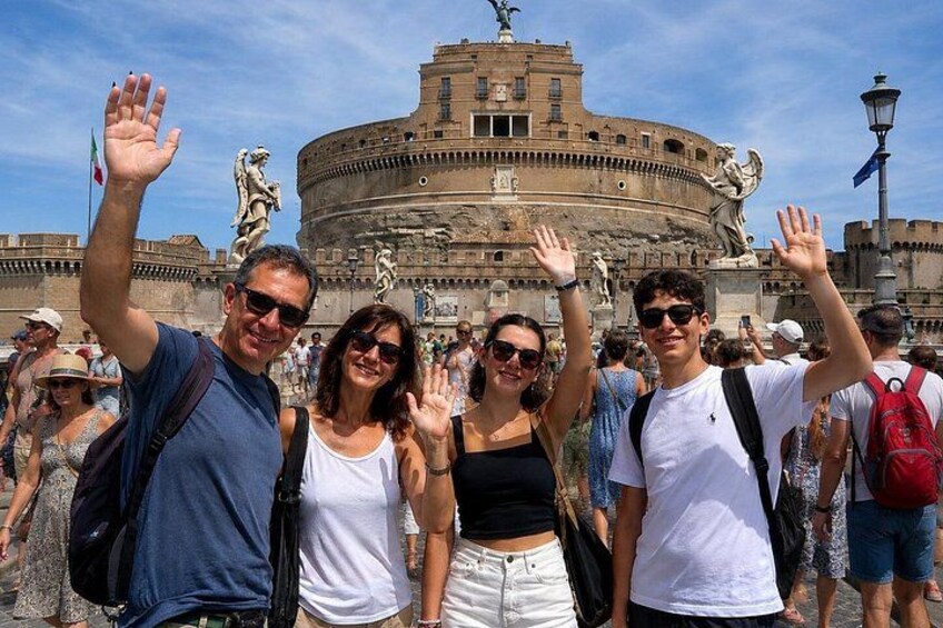 A group of people in front of the Colosseum in Rome, Italy. 3