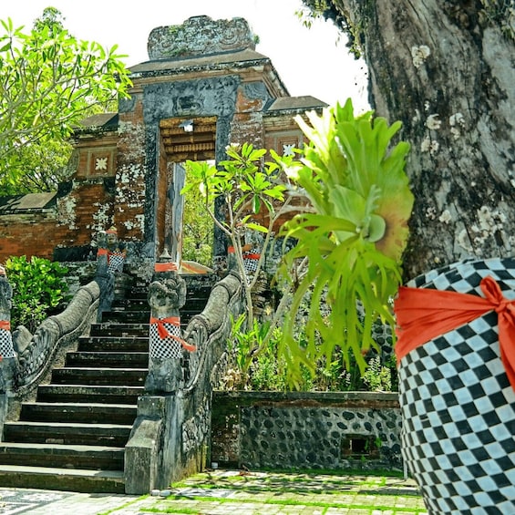 A stone staircase with ornate balustrades, leading to a traditional gate. 3