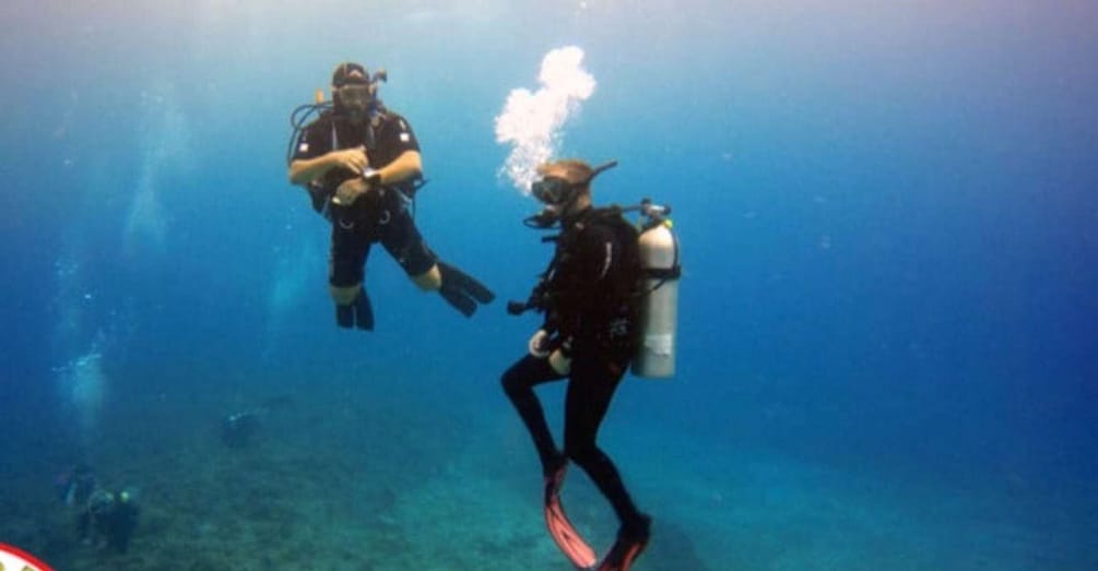 Two scuba divers underwater. 4