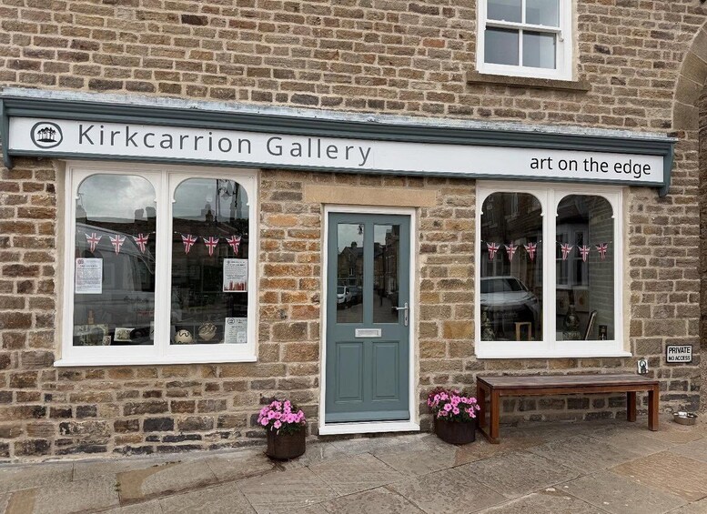 A brick building with a sign reading 'Kirkcarrion Gallery art on the edge.' 5