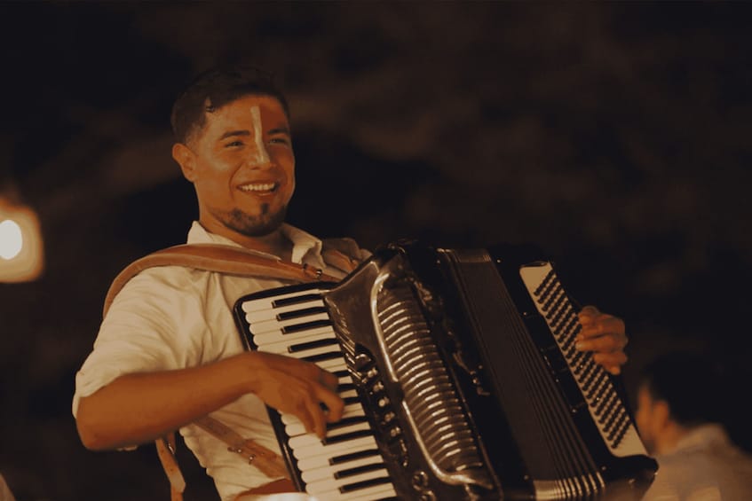 A person playing an accordion. 3