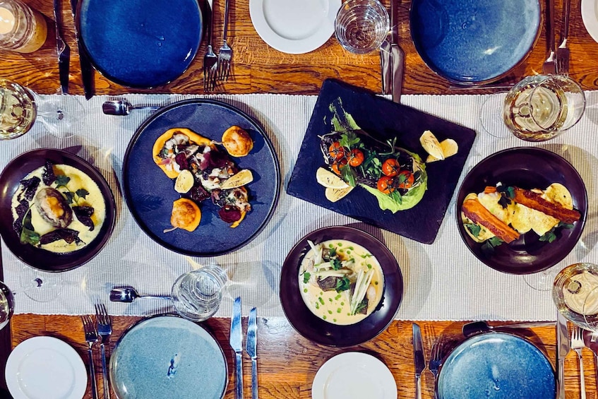 A table set with various dishes, glasses, and cutlery. 2