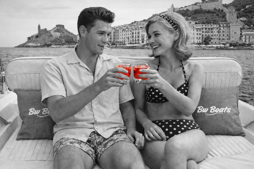 A couple on a boat with a cityscape in the background. 1