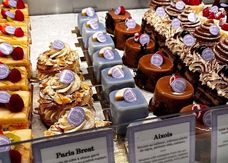 A variety of desserts with labels indicating names like 'Paris Brest' and 'Aixois.' 5