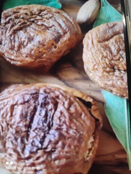 Three pastries on a wooden surface. 4
