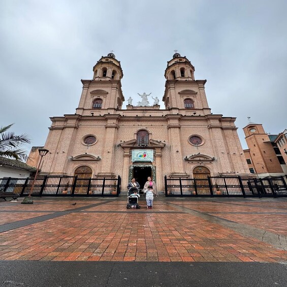 A historic church with two bell towers and a central entrance. 4