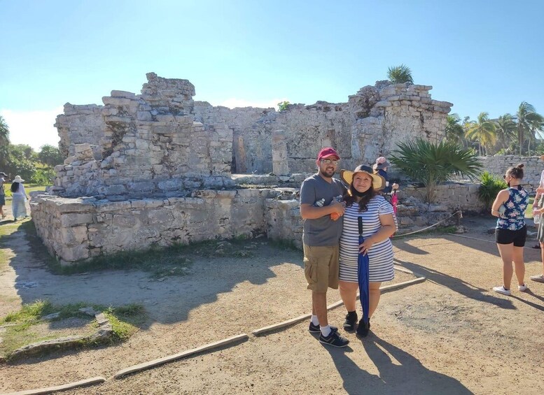 A historical stone structure with visitors. 2