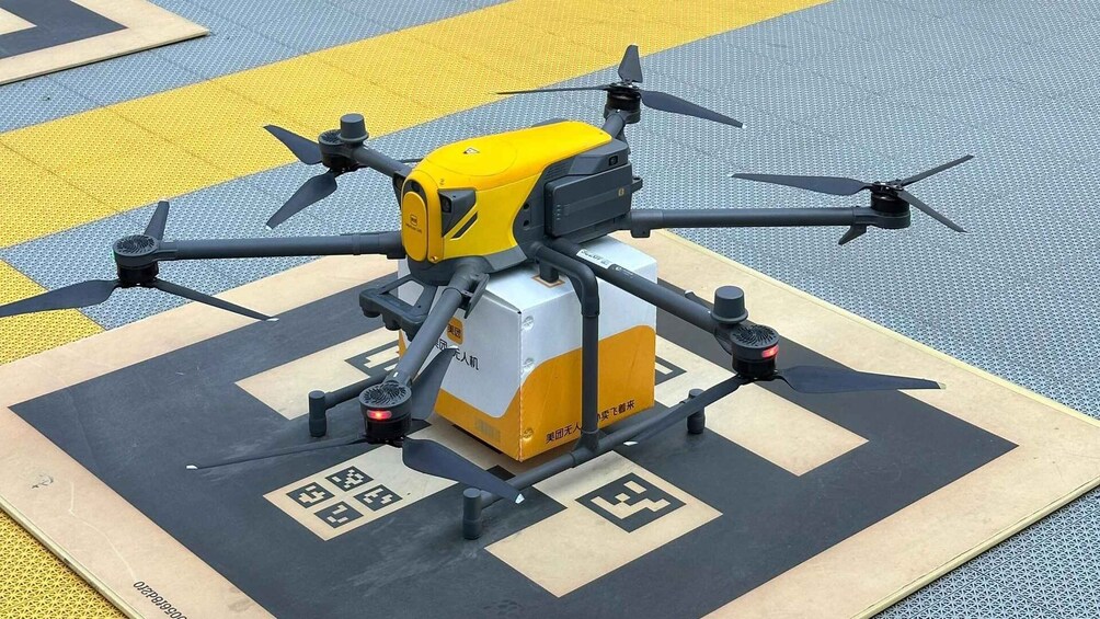A quadcopter drone on a patterned surface with geometric shapes. 4