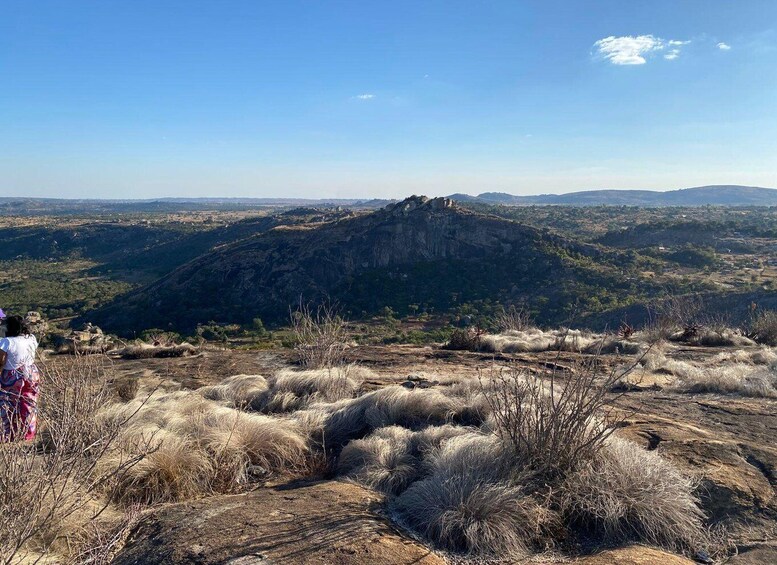 A mountainous landscape with dry grass and a clear sky. 5