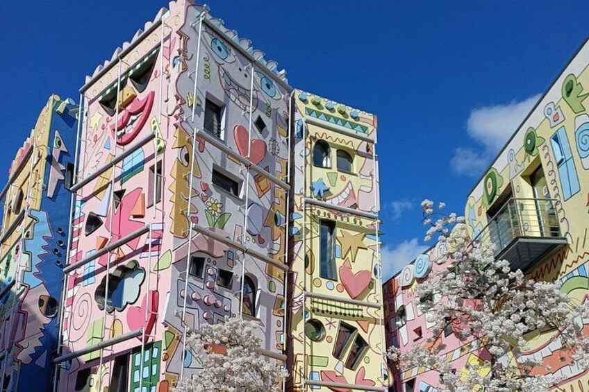 Colorful buildings with unique patterns and designs, including hearts and stars. 2