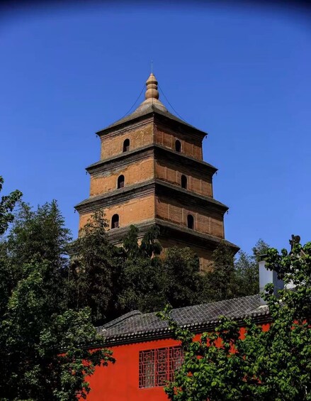 A multi-tiered pagoda with a clear blue sky in the background. 5