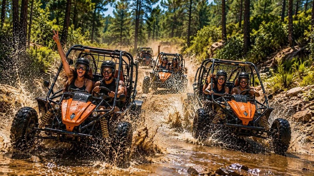 Off-road vehicles navigating a muddy stream in a forest. 1
