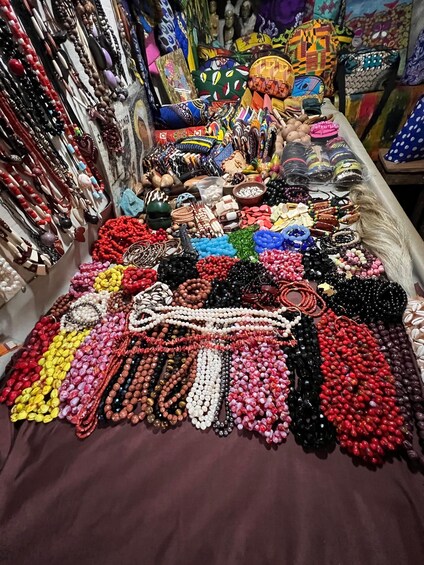 A variety of colorful beads and accessories laid out on a table. 2