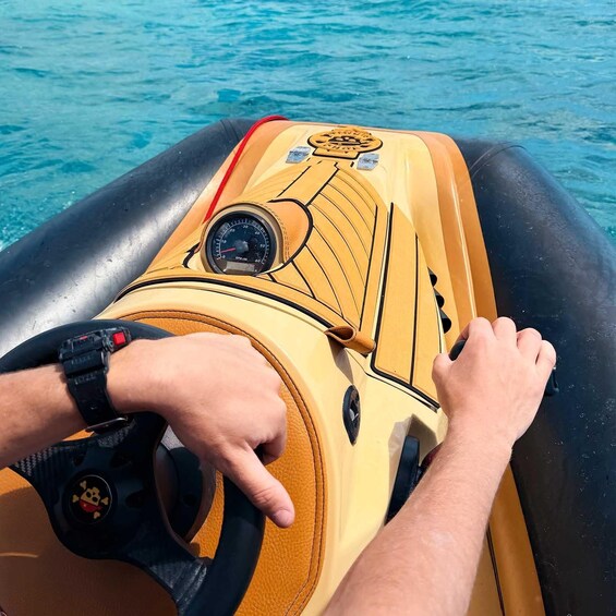 A person steering an inflatable boat on water. 2