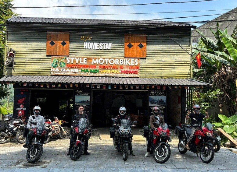 A building with a sign for 'STYLE MOTORBIKES' and 'HOMESTAY.' 3