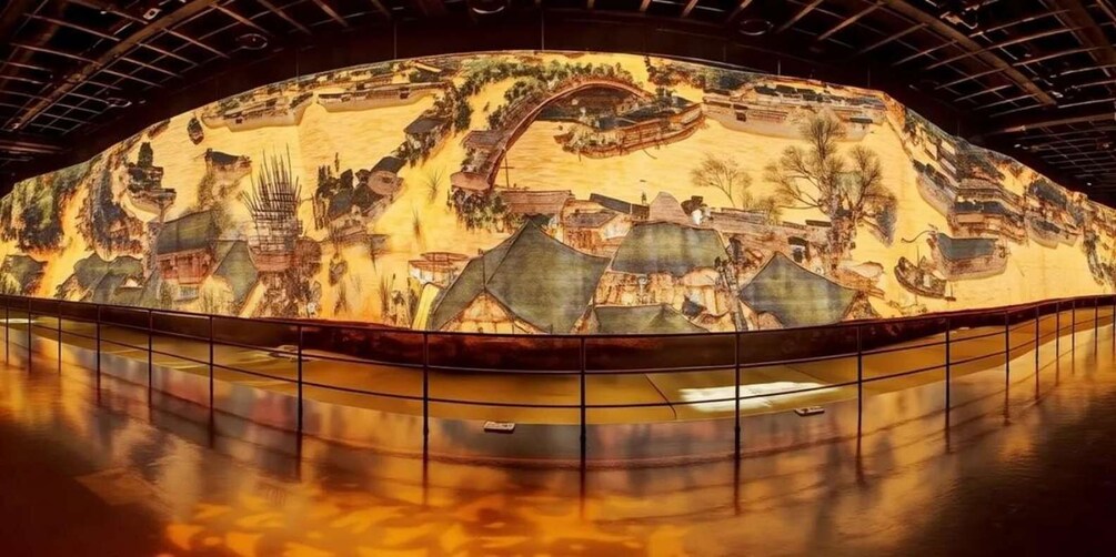 A large mural depicting a traditional village scene with buildings, trees, and a river. 2