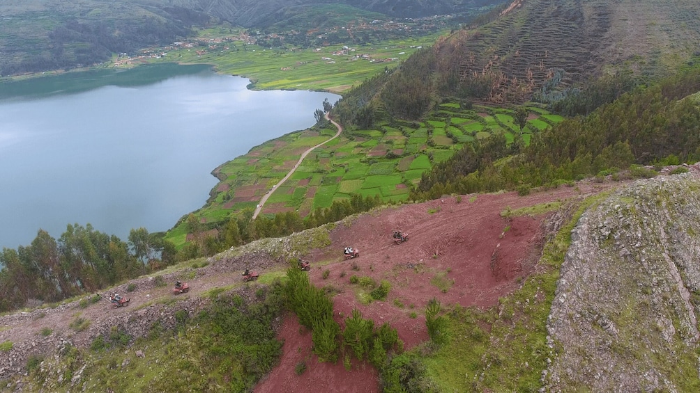 Terraced fields, a winding road, and a lake. 2