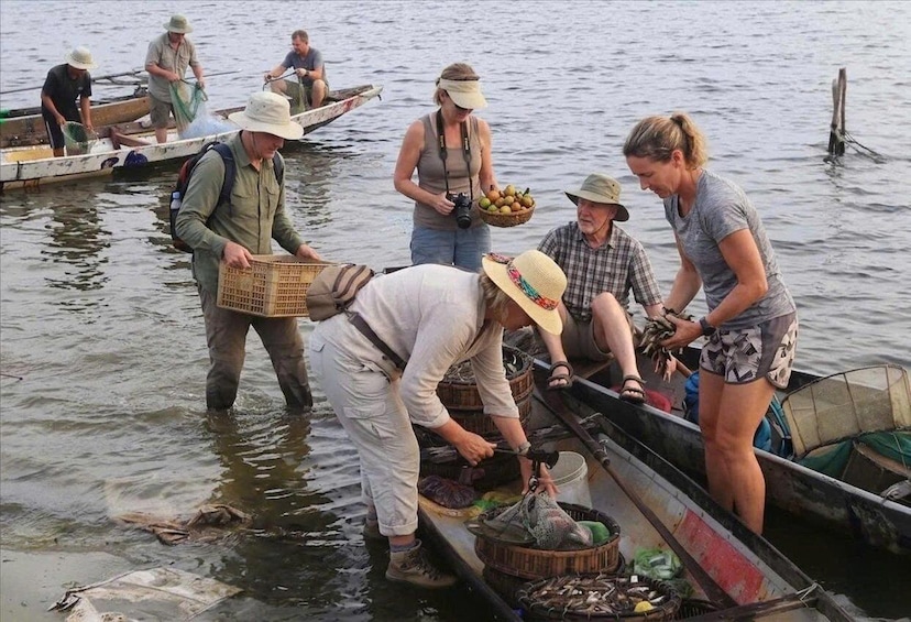 People fishing in a boat on a body of water. 5