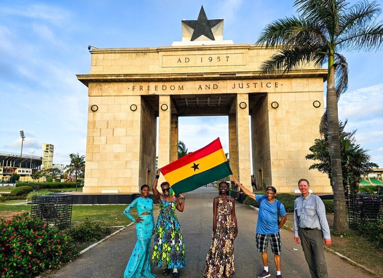 A monument with 'Freedom and Justice' inscribed, a star, and 'AD 1957' above. 1