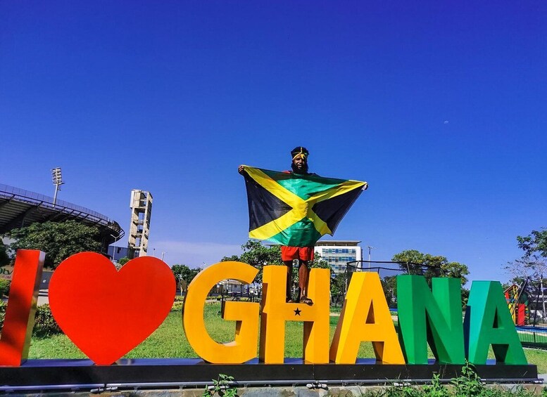 A person holding a flag, with 'I ♥ GHANA' and a heart-shaped sign. 5