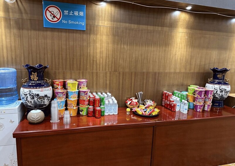 A counter with various food items and a 'No Smoking' sign. 3
