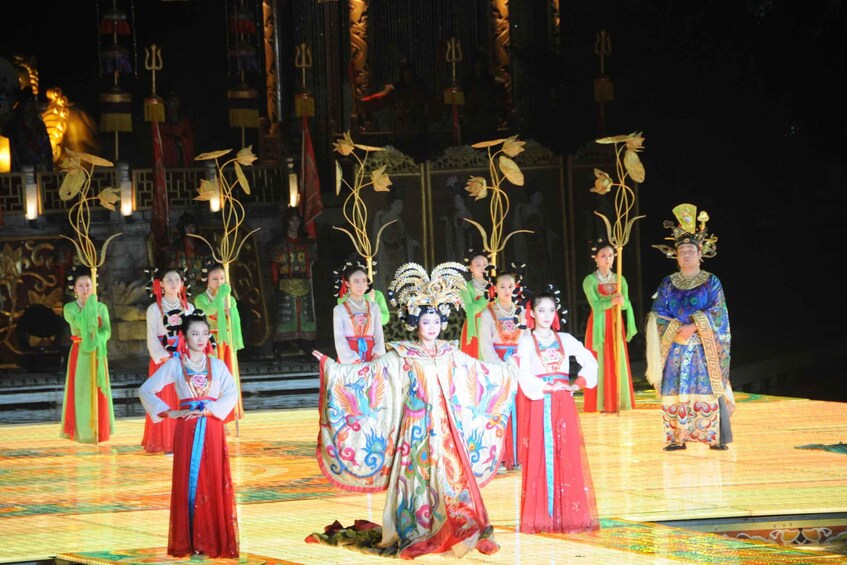 A traditional Chinese opera performance with performers in colorful costumes and elaborate headpieces. 3
