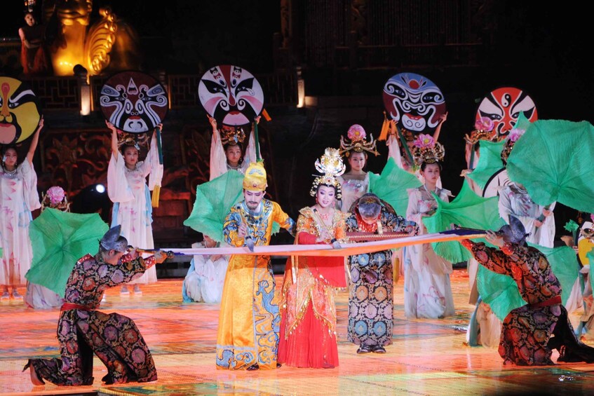 A traditional Chinese opera performance with actors in elaborate costumes and masks. 1