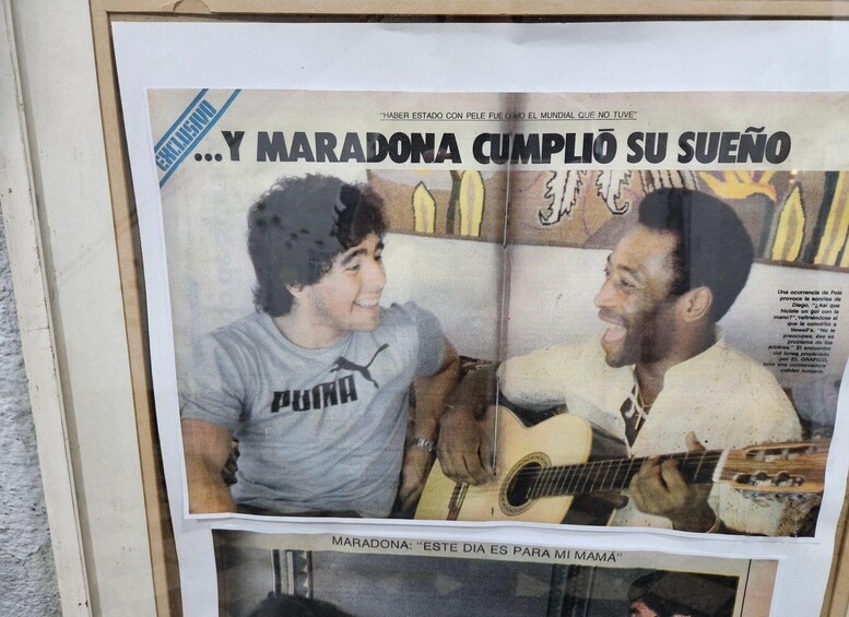 A newspaper article with a man playing a guitar and a woman sitting beside him. 3