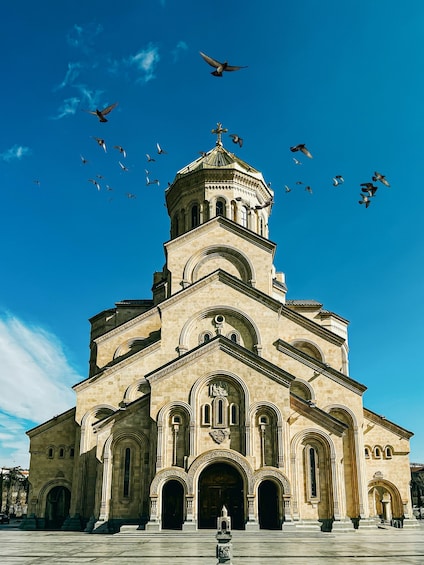 A large, historic church with a prominent dome and multiple arches. 3