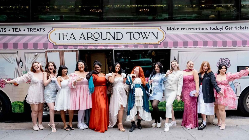 A group of people in front of a food truck named 'TEA AROUND TOWN.' 4