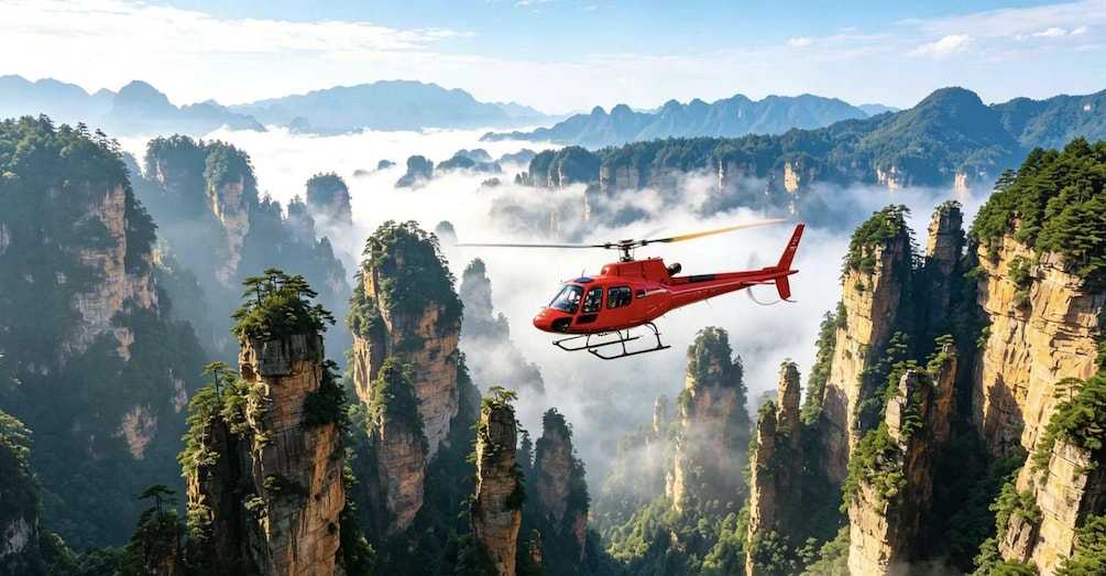 A red helicopter flying over a mountainous landscape with dense forests and mist-covered peaks. 1