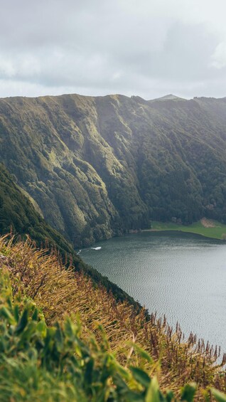 A lake surrounded by forested hills. 3