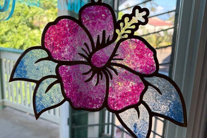 A stained glass window with a floral design. 2