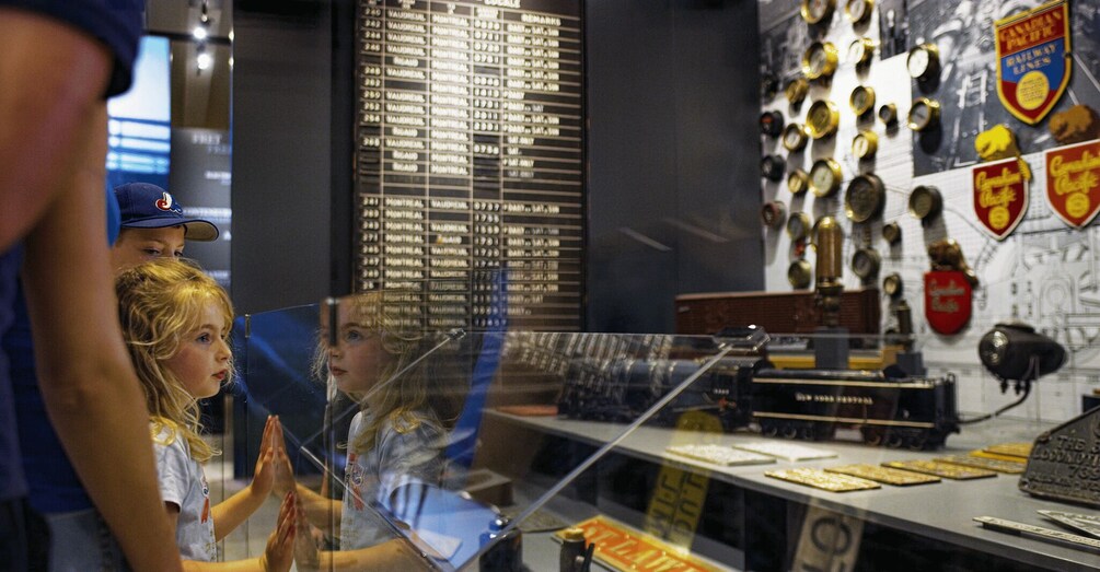 A display of vintage train tickets and a timetable. 3