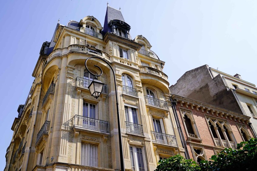 A historic building with ornate balconies and a classic architectural style. 4