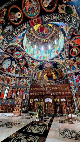 A richly decorated interior with intricate mosaics and religious iconography. 4