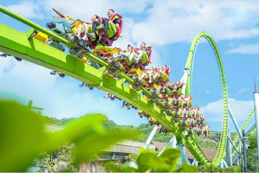 A roller coaster in motion with passengers. 5