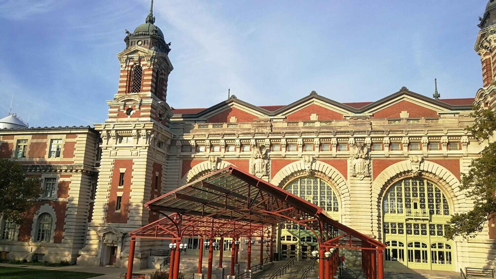 A large, historic building with a prominent clock tower and arched windows. 4