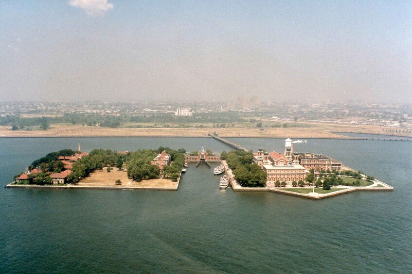 An island with a bridge connecting to the mainland, surrounded by water. 5