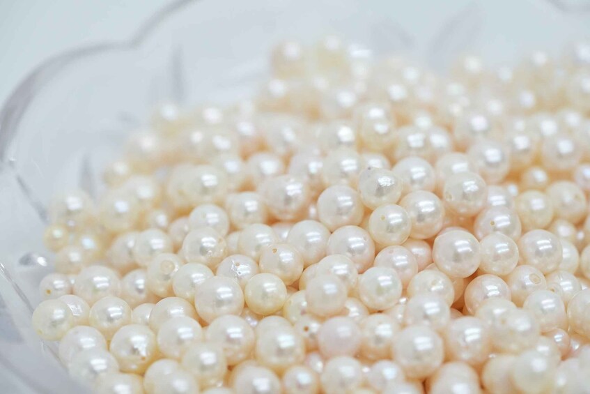 A bowl filled with small, translucent, pearl-like beads. 4